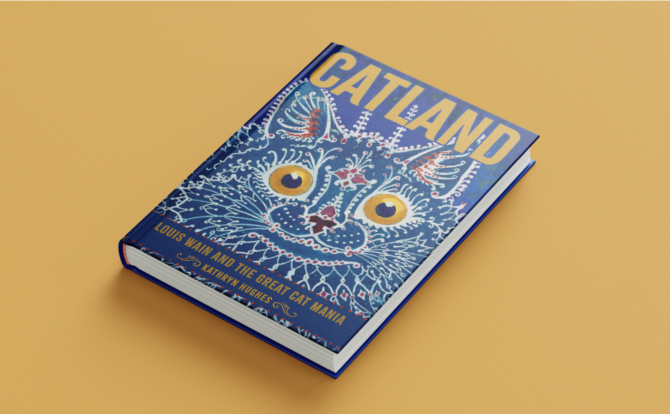 Book Catland, featuring a blue cover and a drawing of a psychedelic cat