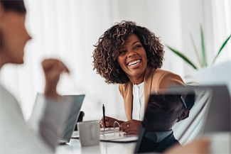 happy women at desk 300 high