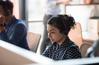 lady working in call center on computer