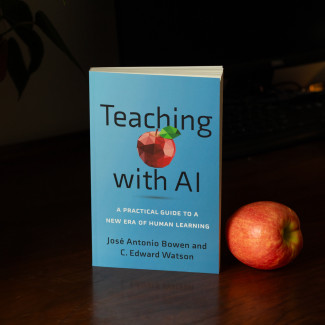 Blue Teaching with AI book cover next to a red apple