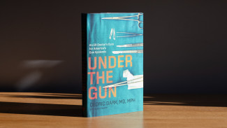 Book cover of Under the Gun featuring a doctor's scalpel on blue scrubs