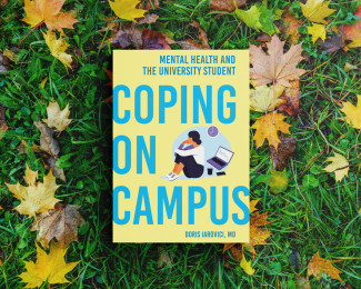 The book "Coping on Campus" by Doris Iarovici laying in grass.