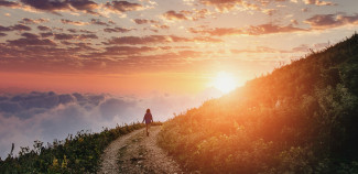 Lady on Sunset Hike in the Mountains