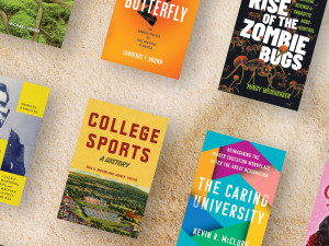 Various books by Hopkins Press on a sandy background.